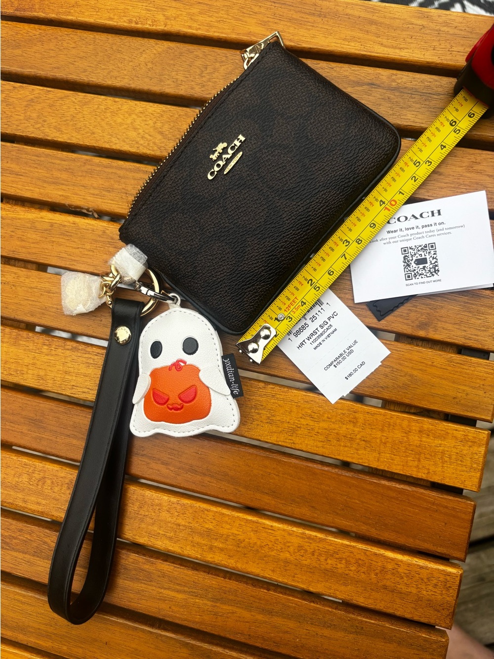 NWT Coach Signature Wristlet + Strap + Coach Flower Charm